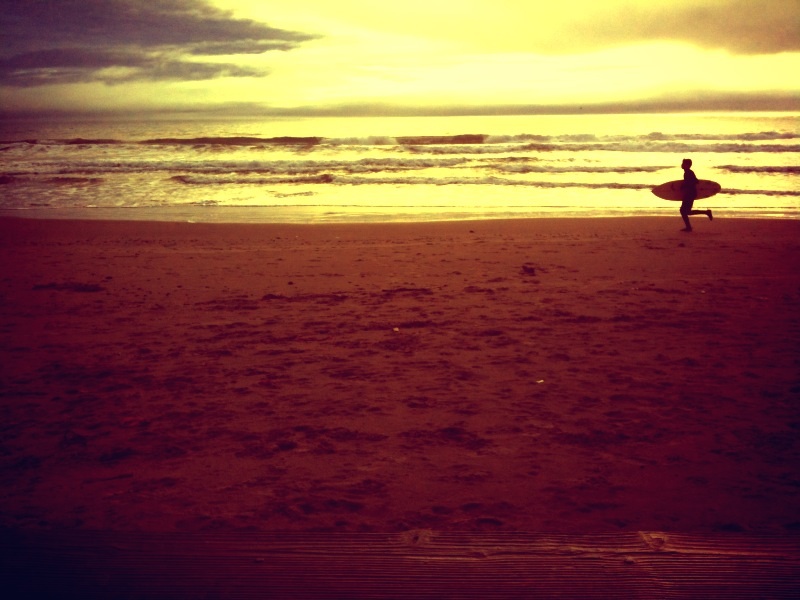 Surfer at Stinson Beach, California.