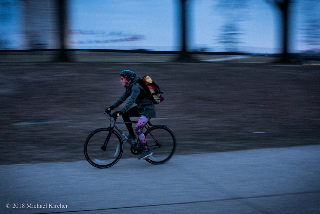 The subway isn't the only way to commute in Washington DC. A bicyclist zips by on her way home from work.